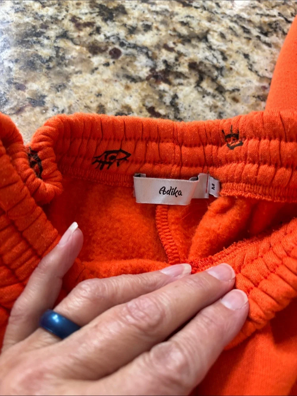 Adika Women’s Bright Orange Eye-Print Crewneck Hoodie and Pants set